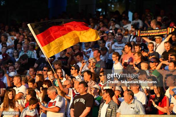 Fan waves a German flag during the FIFA 2018 World Cup Qualifier between Germany and San Marino at Stadion Nurnberg on June 10, 2017 in Nuremberg,...