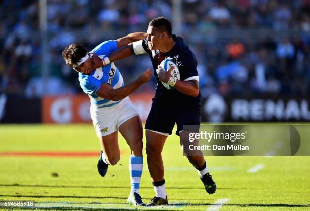 Nathan Hughes of England gets past Matias Moroni of Argentina during the International Test match between Argentina and England at Estadio San Juan...