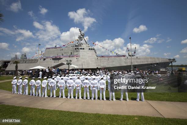 The crew of the USS Gabrielle Giffords stands at the ready prior to the commissioning ceremony on June 10, 2017 in Galveston, Texas. The U.S. Navy...