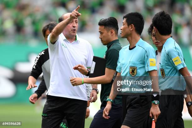 Head Coach Miguel Angel Lotina of Tokyo Verdy questions the linesman's decision after seeing his team's goal disallowed for offside during the...