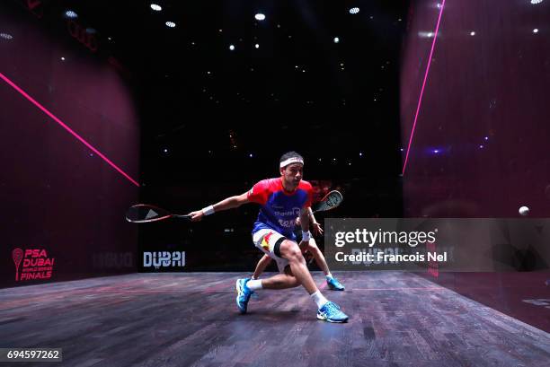 Mohamed El Shorbagy of Egypt competes against James Willstrop of England during the Men's final match of the PSA Dubai World Series Finals 2017 at...