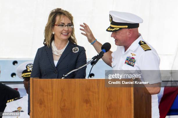 Retired Navy Captain Mark Kelly and his wife Gabrielle Giffords share the podium during the commissioning of the USS Gabrielle Giffords on June 10,...