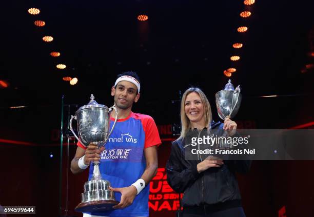 Mohamed El Shorbagy of Egypt and Laura Massaro of England pose with the trophies after winning the finals of the PSA Dubai World Series Finals 2017...