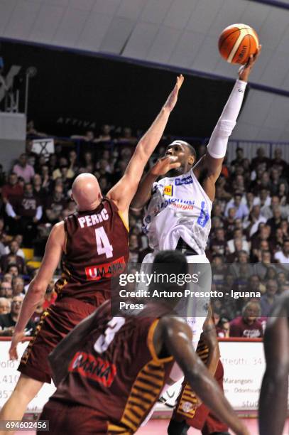 Domanique Sutton of Dolomiti competes with Hrvoje Peric and Melvin Ejim of Umana during the match game 1of play off final series of LBA Legabasket of...