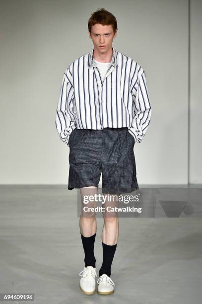 Model walks the runway at the E. Tautz Spring Summer 2018 fashion show during London Menswear Fashion Week on June 10, 2017 in London, United Kingdom.