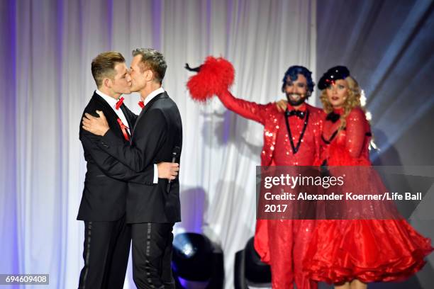 Conchita Wurst cheers during the proposal of a gay couple on stage during the Life Ball 2017 show at City Hall on June 10, 2017 in Vienna, Austria.