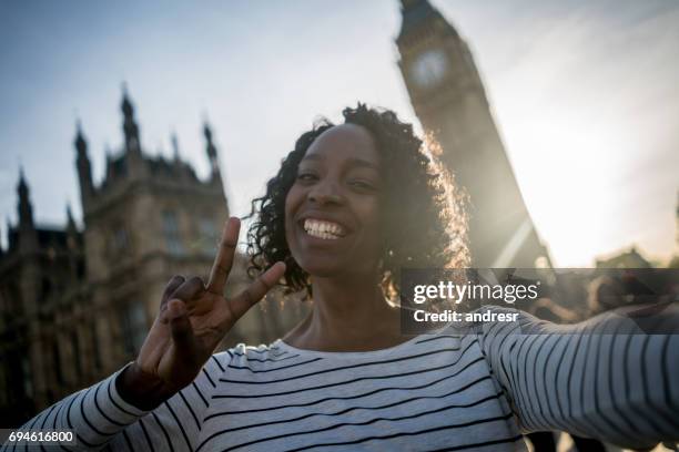 woman taking a selfie in london - big ben selfie stock pictures, royalty-free photos & images