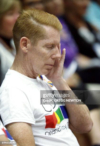 Richard Lamberty of The Orlando Gay Chorus sheds a tear during a memorial service on the first anniversary of the Pulse nightclub shootings, at the...