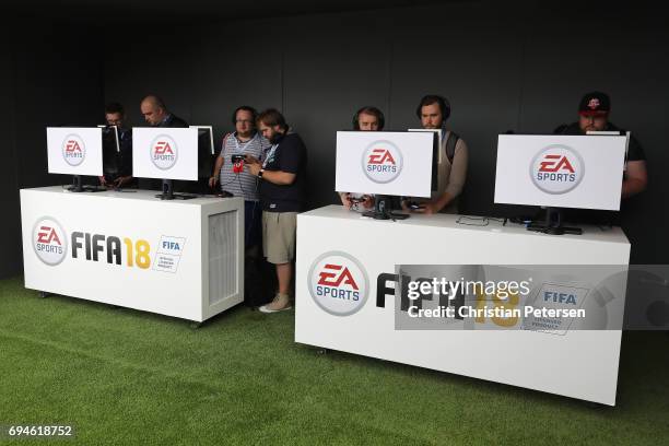 Gamers play EA Sports 'Fifa 18' during the Electronic Arts EA Play event at the Hollywood Palladium on June 10, 2017 in Los Angeles, California. The...