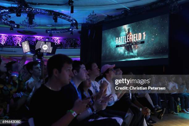 Game enthusiasts and industry personnel watch scenes from 'Battlefield One' during the Electronic Arts EA Play event at the Hollywood Palladium on...