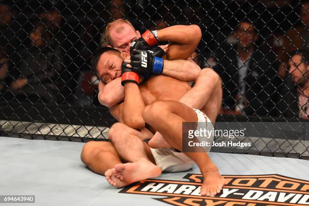 Zak Ottow attempts to submit Kiichi Kunimoto of Japan in their welterweight fight during the UFC Fight Night event at the Spark Arena on June 11,...