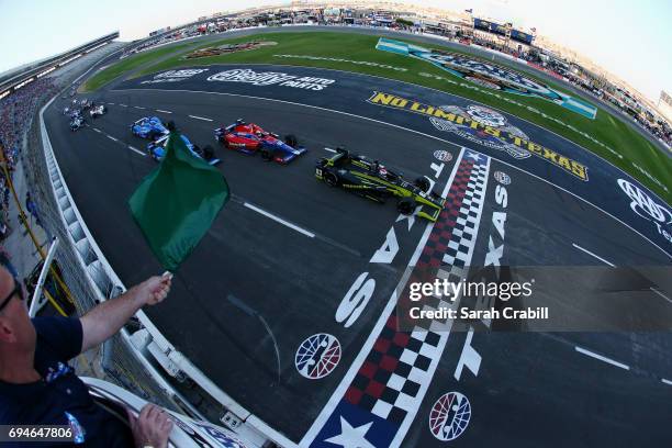 Charlie Kimball, driver of the Tresiba Chip Ganassi Racing Teams Honda, leads the field at the start of the Verizon IndyCar Series Rainguard Water...