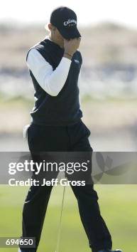 Golfer Ty Tryon is dejected after his double bogey on the 18th hole ...