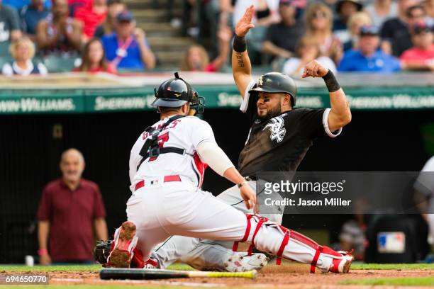 Melky Cabrera of the Chicago White Sox is tagged out at home by catcher Yan Gomes of the Cleveland Indians to end the top of the second inning at...