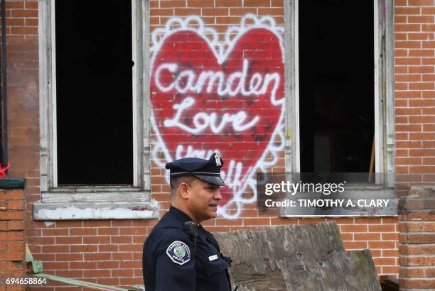 Camden County Police Department officer Louis Sanchez is seen on foot patrol in Camden, New Jersey, on May 24, 2017. In 2013 the city of Camden, New...