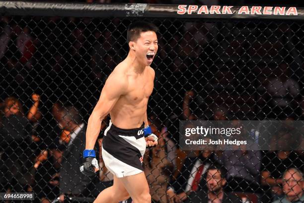 Ben Nguyen celebrates after submitting Tim Elliott in their flyweight fight during the UFC Fight Night event at the Spark Arena on June 11, 2017 in...