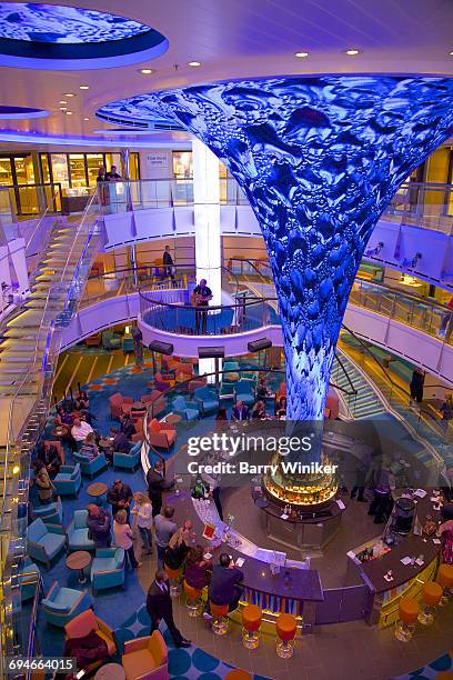 colorful ship lobby with people at bar - building atrium stock pictures, royalty-free photos & images