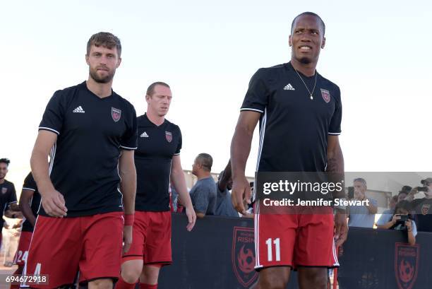 Blair Gavin and Didier Drogba of Phoenix Rising FC take the field for warm ups prior to the match against the Vancouver Whitecaps II at Phoenix...