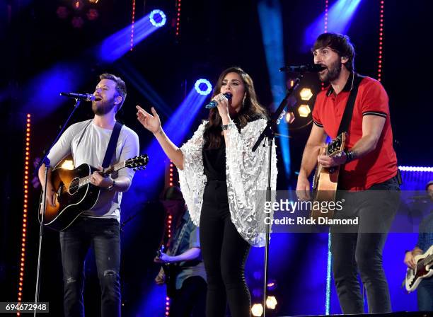 Charles Kelley, Hillary Scott, and Dave Haywood of Lady Antebellum perform onstage during day 3 of the 2017 CMA Music Festival on June 10, 2017 in...