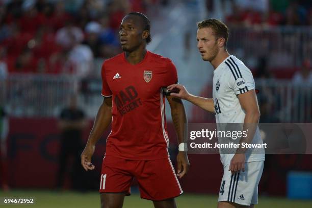 Didier Drogba of Phoenix Rising FC is guarded by Andy Thoma of Vancouver Whitecaps II in the first half at Phoenix Rising Soccer Complex on June 10,...