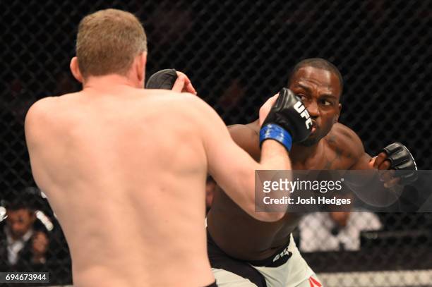 Derek Brunson punches Daniel Kelly of Australia in their middleweight fight during the UFC Fight Night event at the Spark Arena on June 11, 2017 in...
