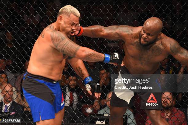 Derrick Lewis punches Mark Hunt of New Zealand in their heavyweight fight during the UFC Fight Night event at the Spark Arena on June 11, 2017 in...