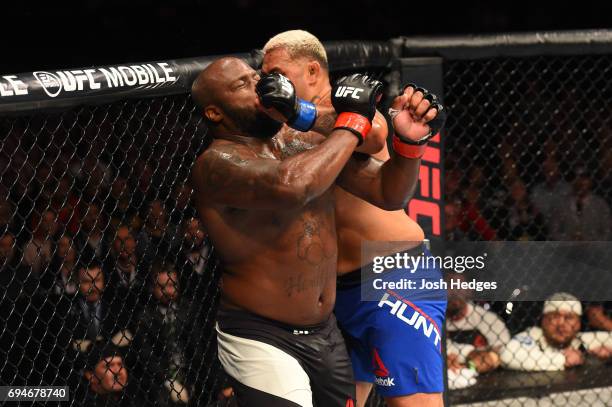 Mark Hunt of New Zealand punches Derrick Lewis in their heavyweight fight during the UFC Fight Night event at the Spark Arena on June 11, 2017 in...