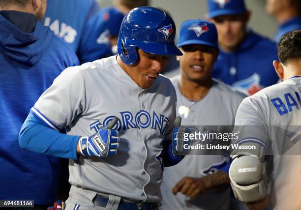 Ezequiel Carrera of the Toronto Blue Jays celebrates his home run in the eighth inning off of Mariners pitcher Tony Zych at Safeco Field on June 10,...