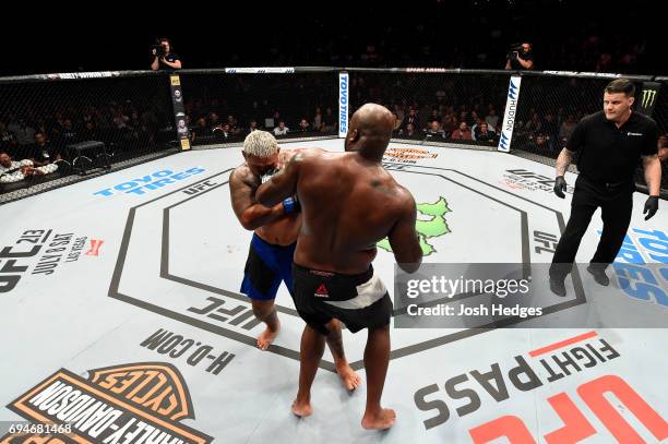 Derrick Lewis punches Mark Hunt of New Zealand in their heavyweight fight during the UFC Fight Night event at the Spark Arena on June 11, 2017 in...