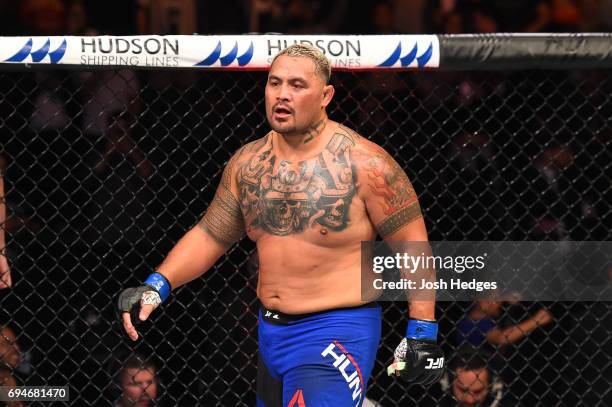 Mark Hunt of New Zealand reacts after defeating Derrick Lewis by TKO in their heavyweight fight during the UFC Fight Night event at the Spark Arena...