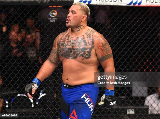 Mark Hunt of New Zealand reacts after defeating Derrick Lewis by TKO in their heavyweight fight during the UFC Fight Night event at the Spark Arena...