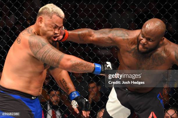 Derrick Lewis punches Mark Hunt of New Zealand in their heavyweight fight during the UFC Fight Night event at the Spark Arena on June 11, 2017 in...