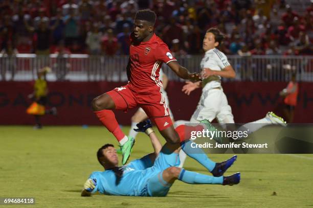 Jason Johnson of Phoenix Rising FC jumps to avoid Sean Melvin of Vancouver Whitecaps II in the second half at Phoenix Rising Soccer Complex on June...