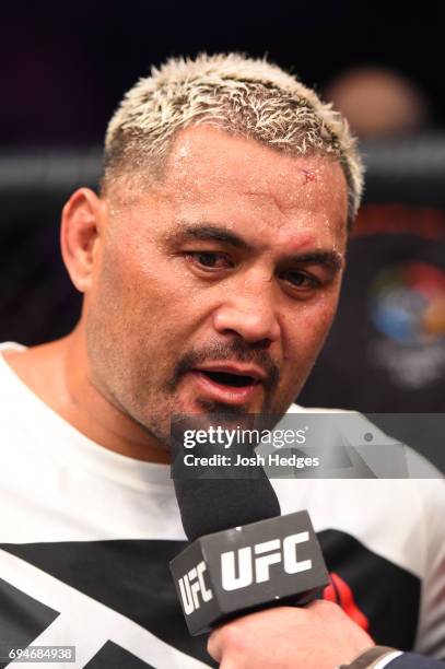 Mark Hunt of New Zealand is interviewed by Brian Stann after defeating Derrick Lewis in their heavyweight fight during the UFC Fight Night event at...