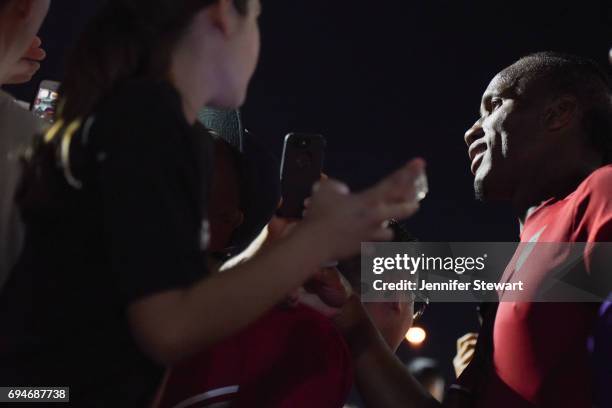 Didier Drogba of Phoenix Rising FC signs autographs for fans after the game against the Vancouver Whitecaps II through fans at Phoenix Rising Soccer...