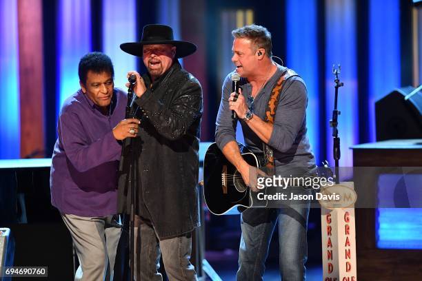 Recording Artists Charley Pride and Eddie Montgomery and Troy Gentry of Montgomery Gentry perform onstage at The Grand Ole Opry on June 10, 2017 in...
