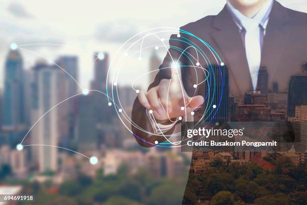businessman hand working with modern technology and digital layer effect as business strategy concept - westernization stock pictures, royalty-free photos & images