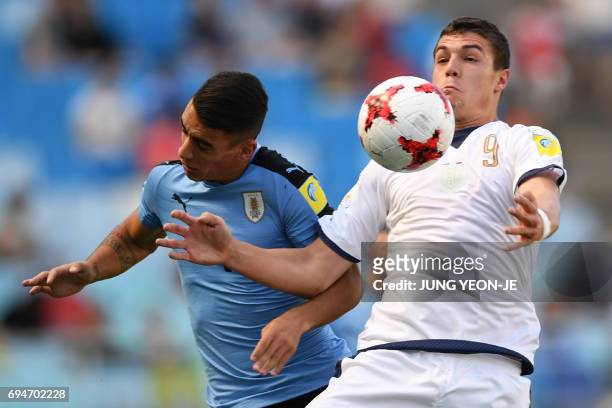 Uruguay's defender Jose Luis Rodriguez and Italy's forward Andrea Favilli compete for the ball during the U-20 World Cup third place play-off...