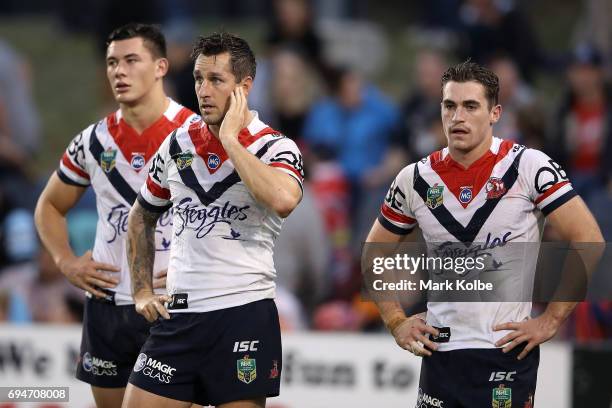 Mitchell Pearce and Connor Watson of the Roosters looks dejected after a Tigers try during the round 14 NRL match between between the Wests Tigers...