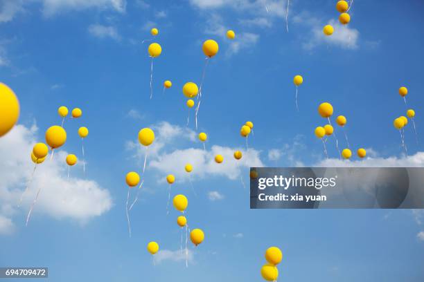 Balloon Ride Yellow 1,125 Yellow Balloons Blue Sky Stock Photos, High-Res Pictures, and ...