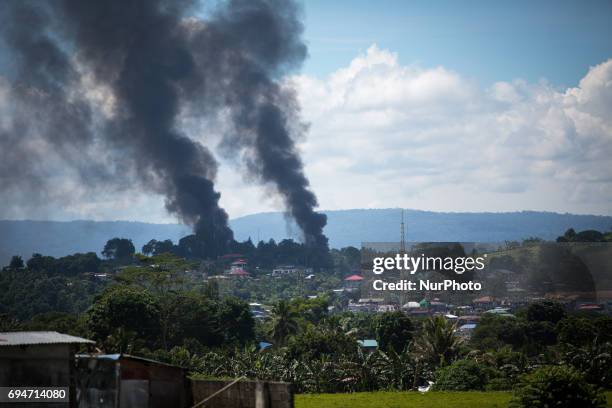 Smoke following an airstrikes by Philippine Air Force in Marawi city, southern Philippines on June 11, 2017. Philippine military jets fired rockets...