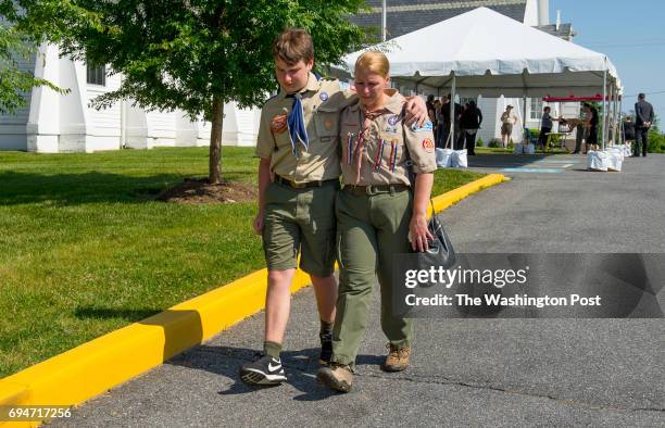 Branimir, left and and Melissa Udbinac walk outside the visitation and services for Artem Ziberov at Neelsville Presbyterian Church on June 9, 2017...