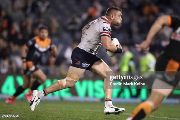 Jared Waerea-Hargreaves of the Roosters makes a break during the round 14 NRL match between between the Wests Tigers and the Sydney Roosters at...