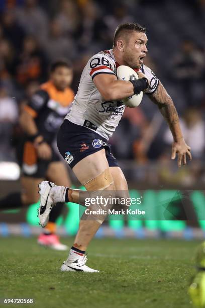 Jared Waerea-Hargreaves of the Roosters makes a break during the round 14 NRL match between between the Wests Tigers and the Sydney Roosters at...