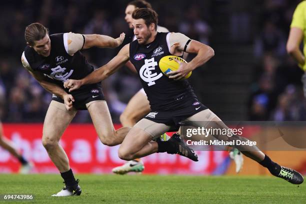 Dale Thomas of the Blues crashes into Bryce Gibbs during the round 12 AFL match between the Carlton Blues and the Greater Western Sydney Giants at...