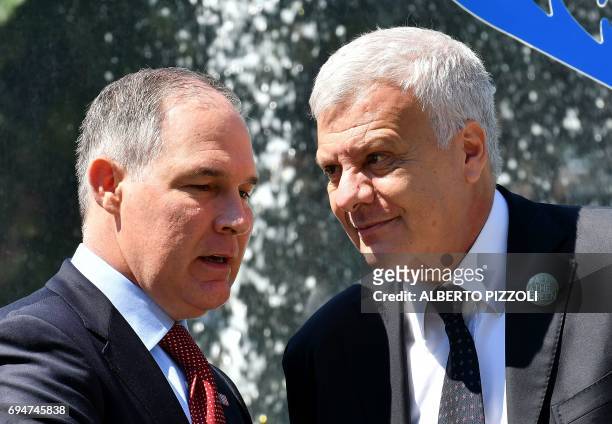 Head of the Environmental Protection Agency Scott Pruitt talks with Italy's Environment Minister Gian Luca Galletti prior to posing for a group photo...