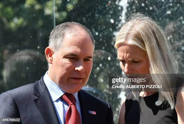 Head of the Environmental Protection Agency Scott Pruitt and Canada's Environment Minister Catherine McKenna talk prior to posing for a group photo...