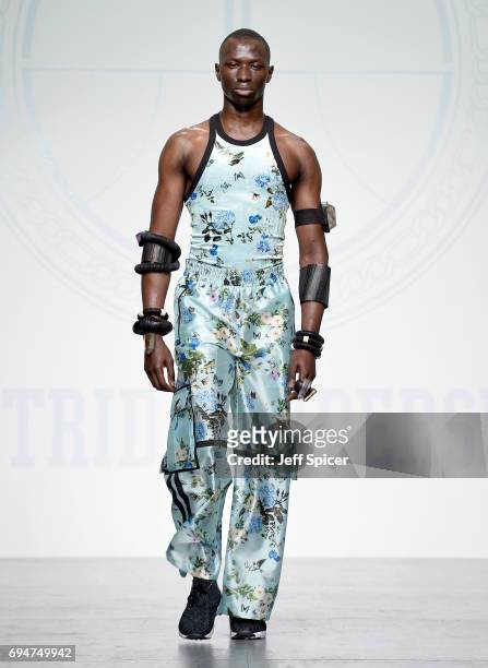 Model walks the runway at the Astrid Andersen show during the London Fashion Week Men's June 2017 collections on June 11, 2017 in London, England.