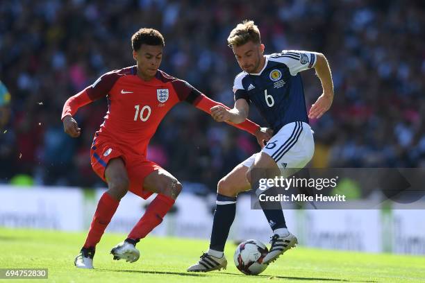James Morrison of Sotland is challenged by Dele Alli of England during the FIFA 2018 World Cup Qualifier between Scotland and England at Hampden Park...