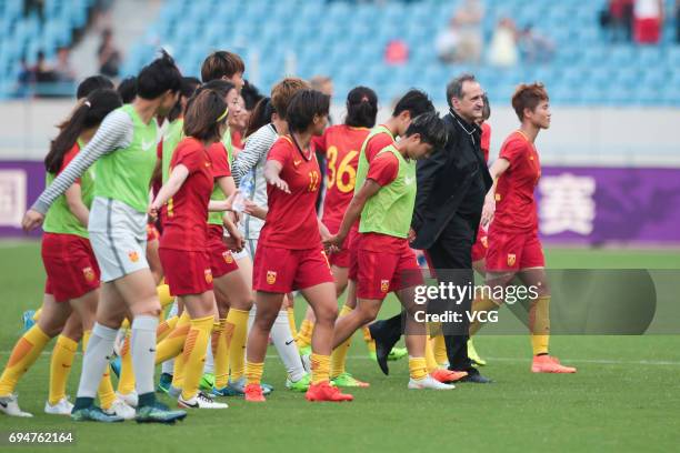 Head coach Bruno Bini and players of China thank supporters after winning the Friendly International Women 2017 between China and Finland at...